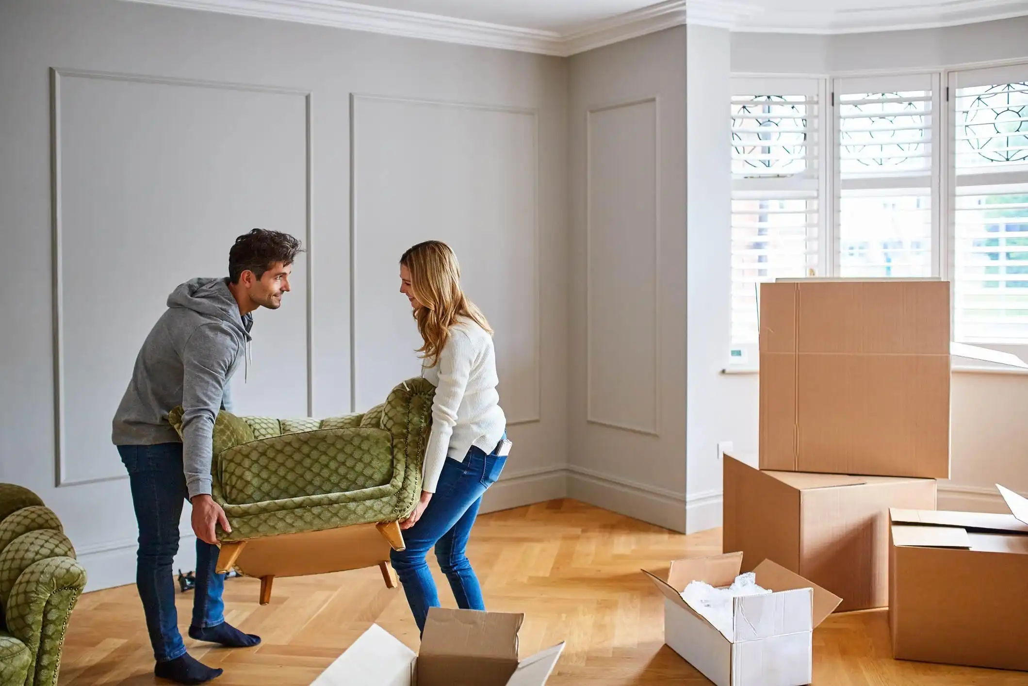 young-couple-moving-in-to-new-home