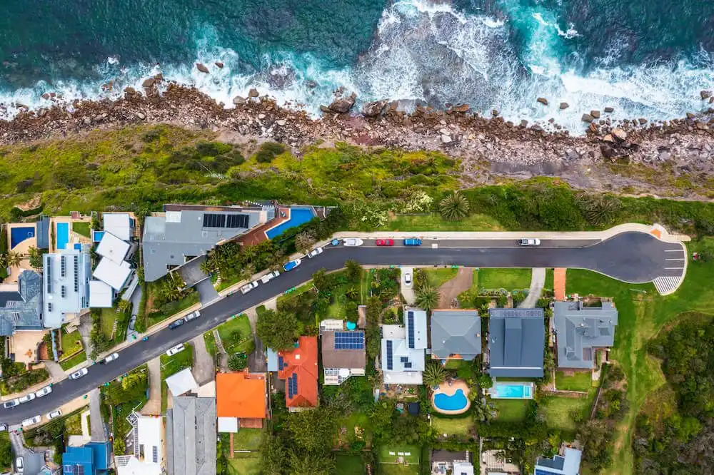 suburban-rooftops-alongside-beach