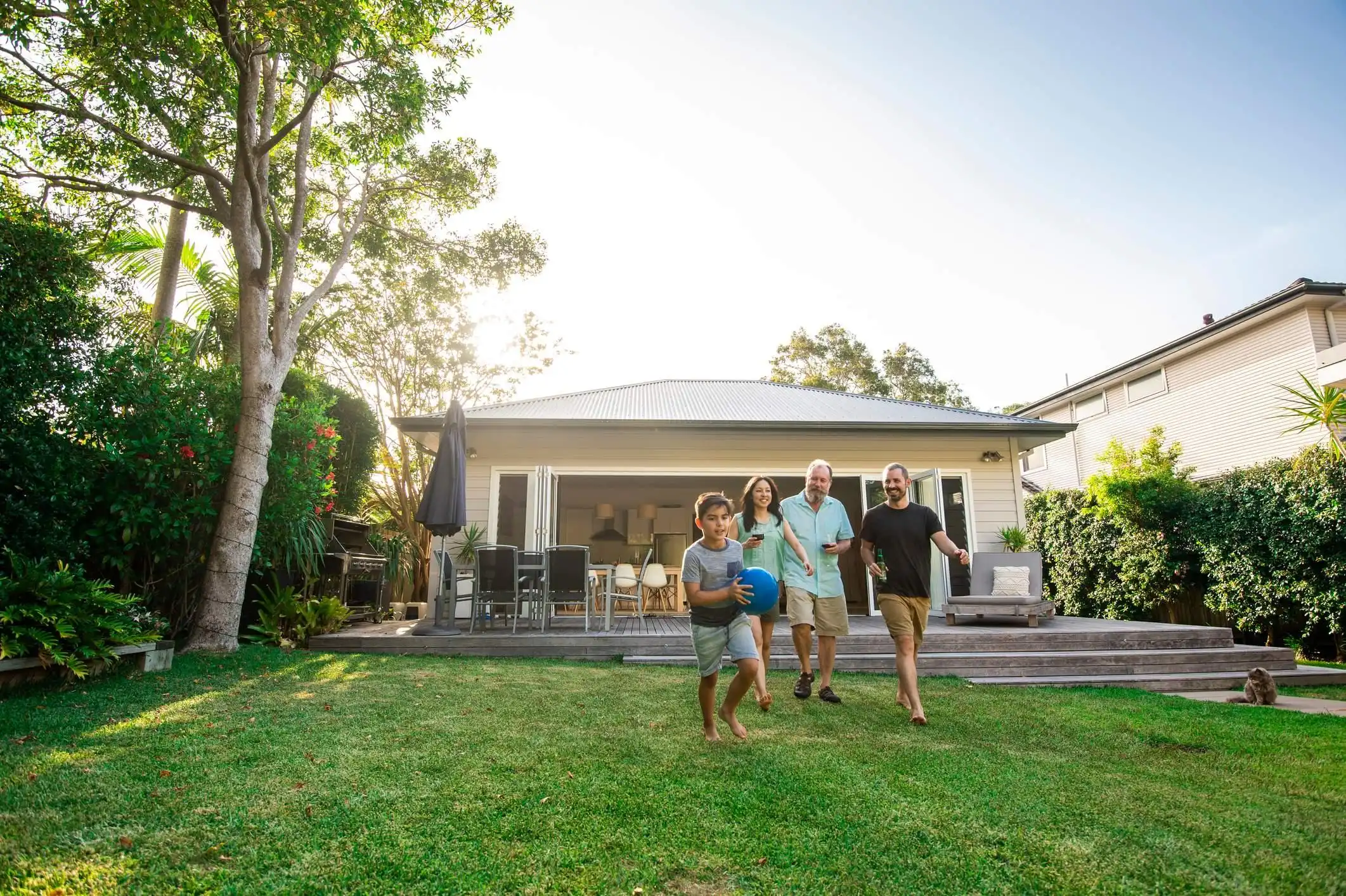 family-playing-in-backyard